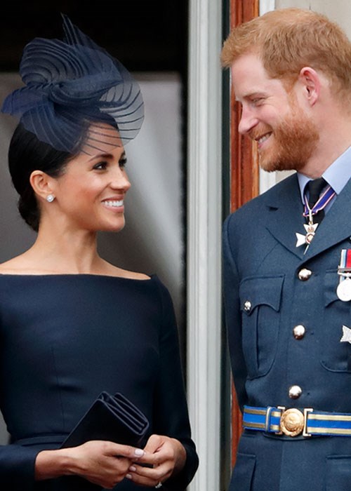 Prince Harry fixes Meghan Markle's hair